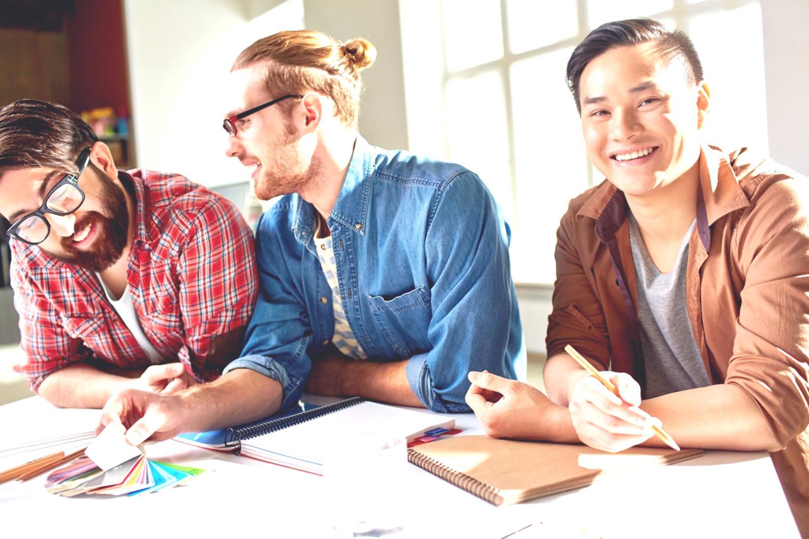 Financial analyst reviewing market data and research reports at a modern workstation
